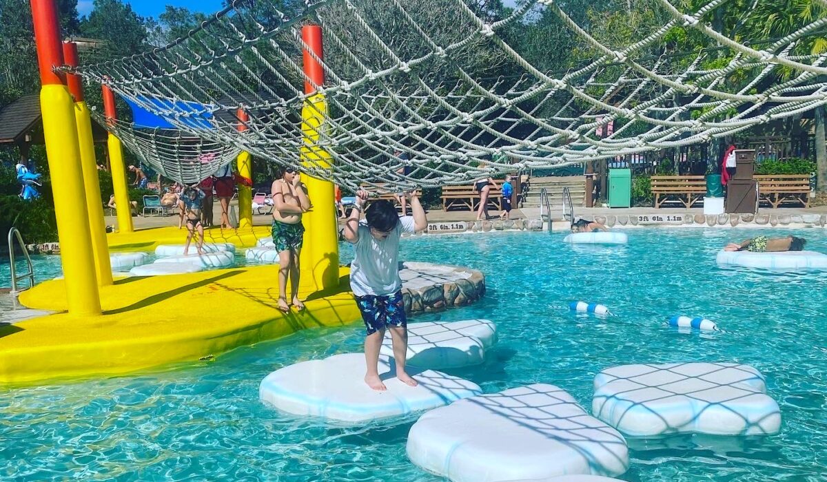 children playing on lily pads in a Blizzard Beach pool at Disney World