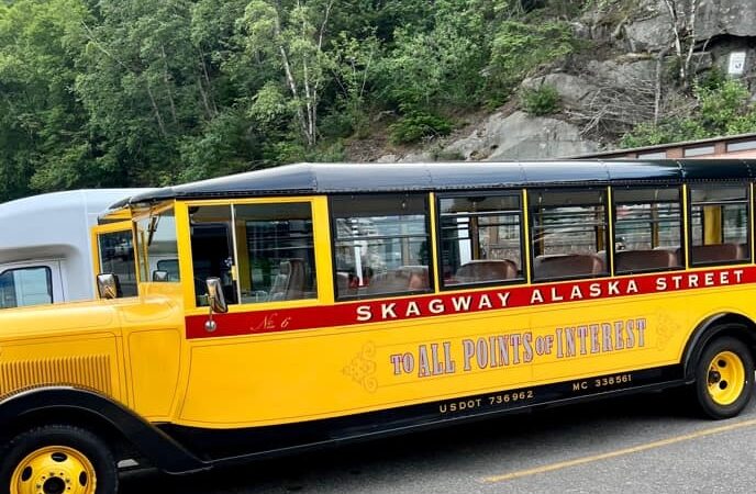 Bright yellow Tour vehicle on Disney Cruise stop in Skagway
