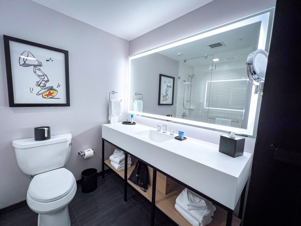 Bathroom sink and toilet Pixar Place Hotel