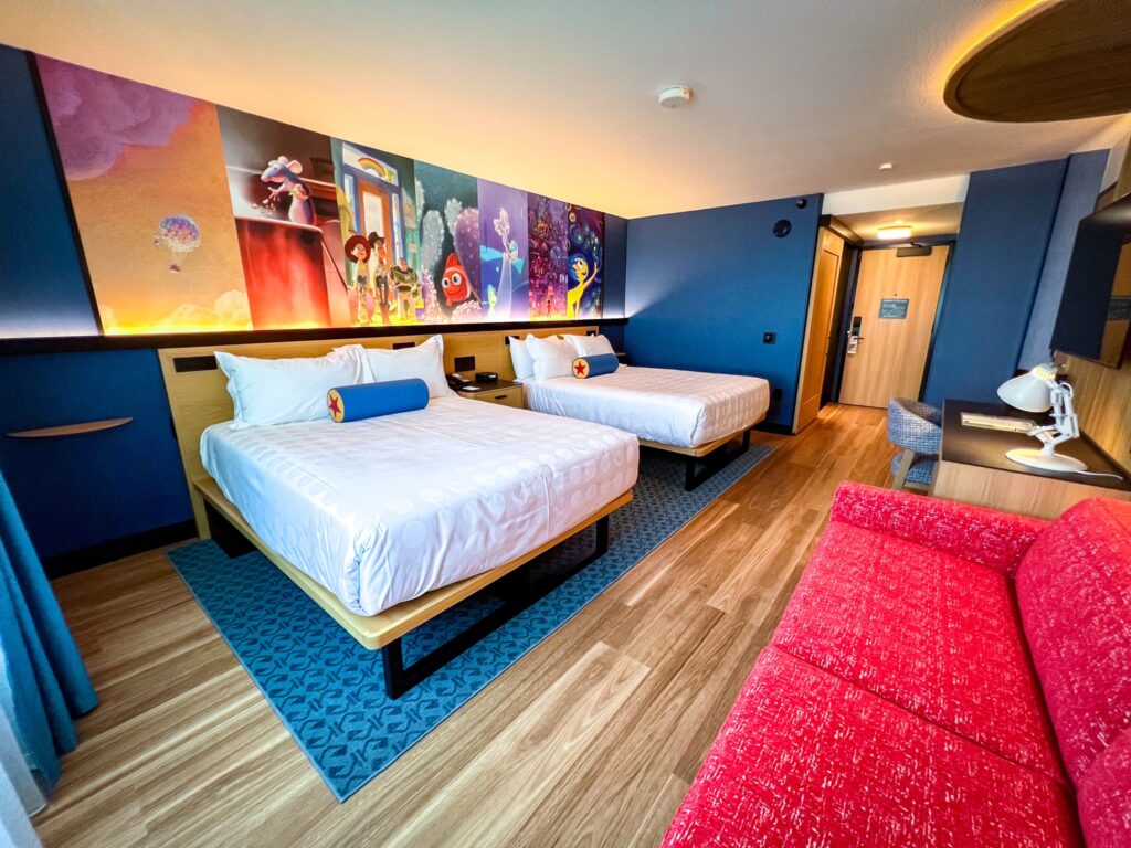 2 beds and sofa in Pixar Place Hotel