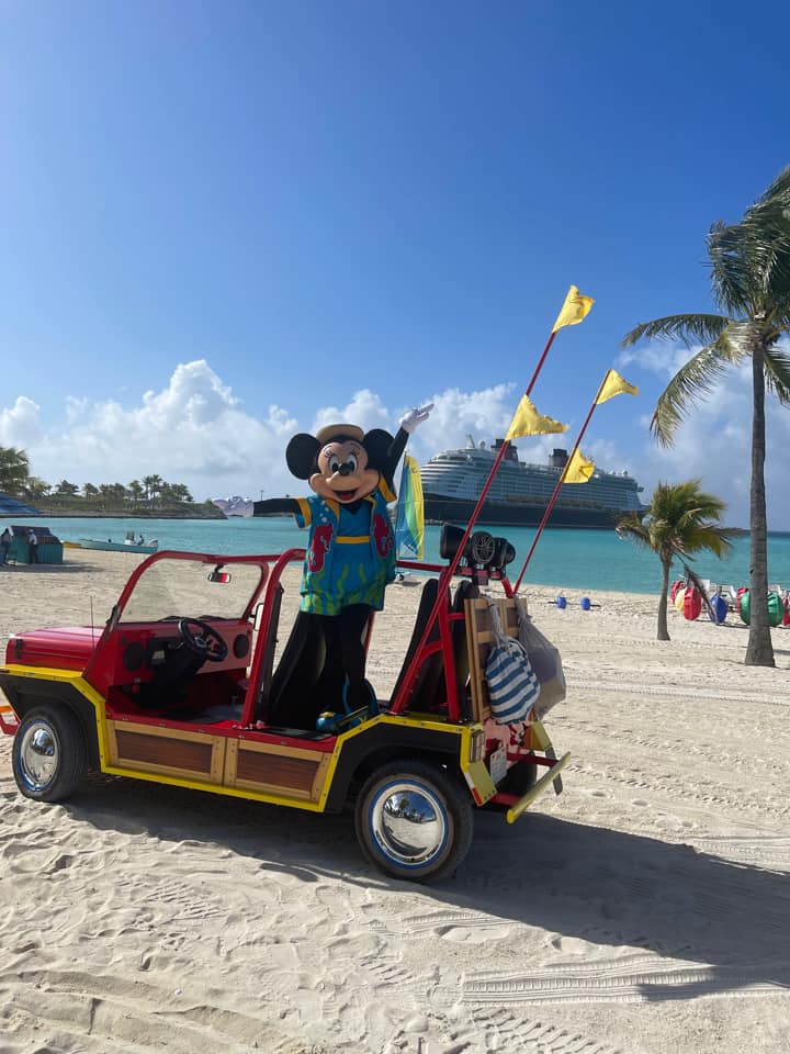 Minnie Mouse waving in jeep at Castaway Cay