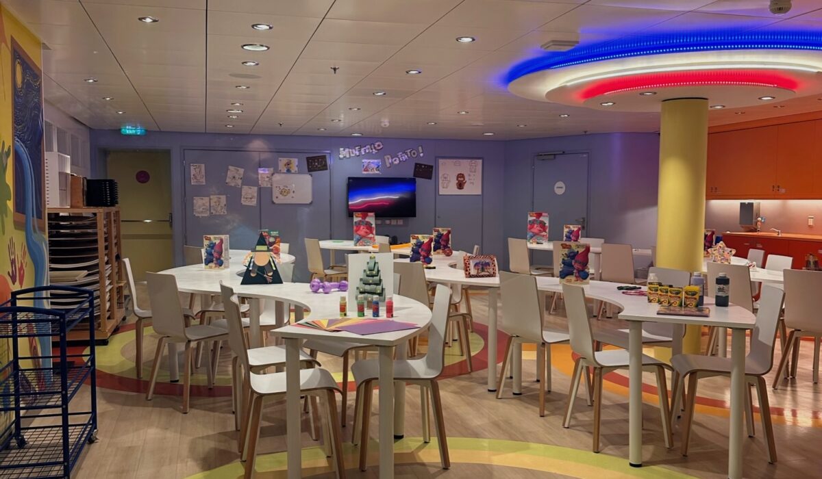 Tables and chairs set up for arts and crafts in Royal Caribbeans Adventure Ocean Kids club