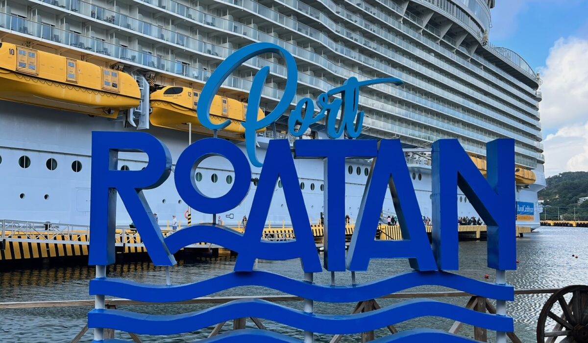 Port of Roatan sign with Royal Caribbean Harmony of the seas behind photo